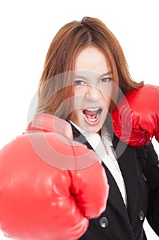 Businesswoman boxing punching towards and ready to fight