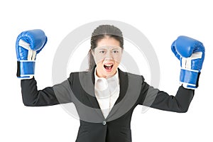 Businesswoman boxing showing flexing muscles