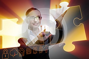 The businesswoman in business concept with puzzle piece