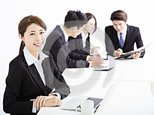 Businesswoman with business people having meeting together