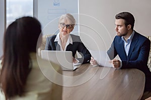 Businesswoman and businessman HR manager interviewing lady