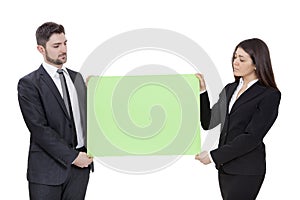 Businesswoman and businessman keeping signboard