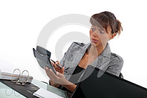 Businesswoman with a calculator