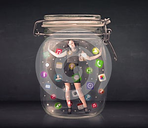 Businesswoman captured in a glass jar with colourful app icons c