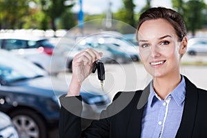 Businesswoman with car keys