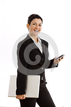 Businesswoman with cellphone and laptop isolated