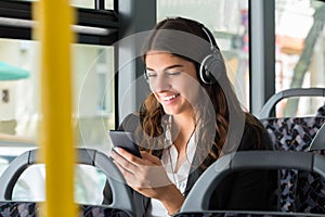 Businesswoman With Cellphone Listening Music