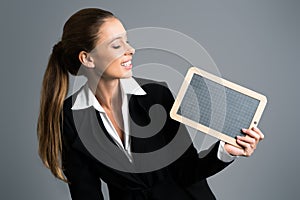 Businesswoman with a chalkboard