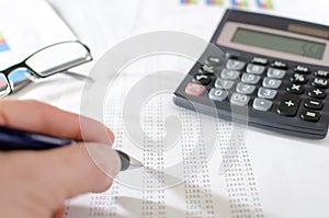 Businesswoman checking financial documents