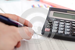 Businesswoman checking financial documents