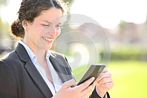 Businesswoman checking smart phone