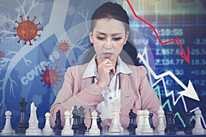 Businesswoman with chess and downturn graph