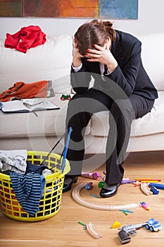 Businesswoman and children's mess photo