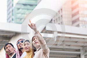 Businesswoman with clicked her finger on building background. Business and Teamwork concept.