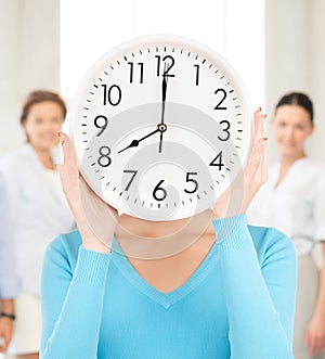 Businesswoman with clock over her face