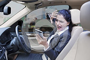 Businesswoman closing her face in car