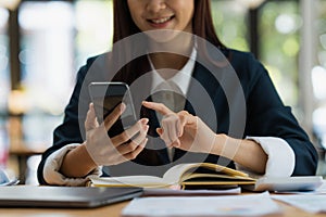 A businesswoman completes KYC using an online banking program in order to open a digital savings account. The definition