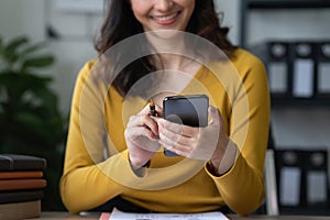 A businesswoman completes KYC using an online banking program in order to open a digital savings account. The definition