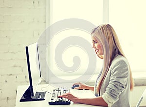 Businesswoman with computer in office