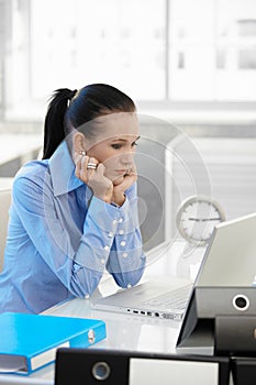 Businesswoman concentrating on computer work photo