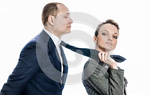 Businesswoman in control of a man
