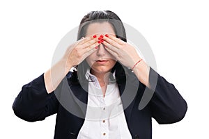 Businesswoman covering eyes using hands as secret concept