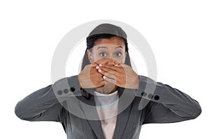 Businesswoman covering her mouth