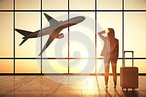 Businesswoman in creative airport interior