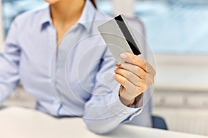 Businesswoman with credit card at office