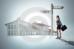 The businesswoman at crossroads betweem buying and renting