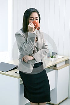 Businesswoman with a cup of coffee photo