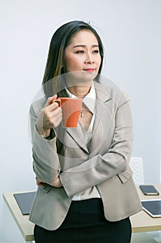 Businesswoman with a cup of coffee photo
