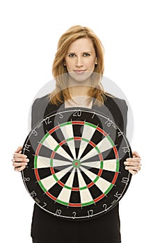 Businesswoman with dart board