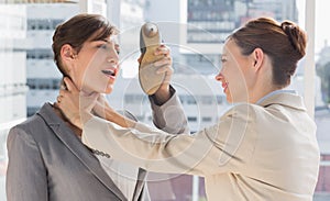 Businesswoman defending herself from her colleague strangling her