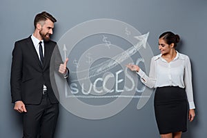 Businesswoman demonstrates success to her partner