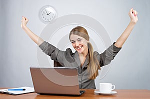 Businesswoman at desk with arms