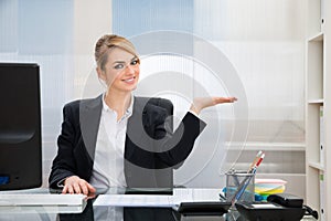 Businesswoman displaying invisible product