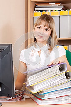 Businesswoman with documents working in office
