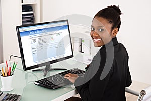 Businesswoman Doing Online Banking On Computer