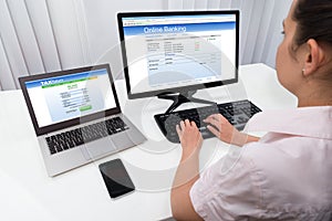 Businesswoman Doing Online Banking On Computer