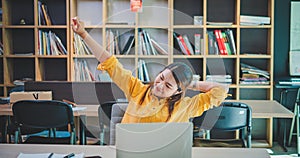 businesswoman is doing a relaxing pose to relieve fatigue after working for a long time