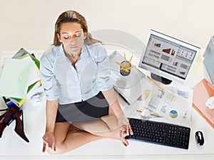 Businesswoman doing yoga