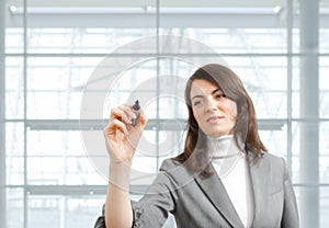 Businesswoman drawing with marker