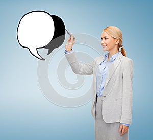 Businesswoman drawing text bubble