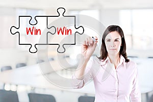 Businesswoman drawing a Win Win Puzzle Concept on the virtual screen. Office background.