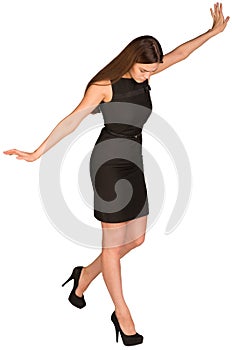 Businesswoman in dress looking down fearfully