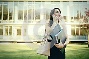 Businesswoman in dress outdoors