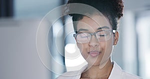 Businesswoman, drinking and coffee by computer for work, online research and reading with glasses in office. Person