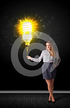 Businesswoman with an eco-friendly bulb