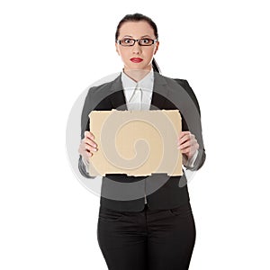 Businesswoman with empty cardboard sign